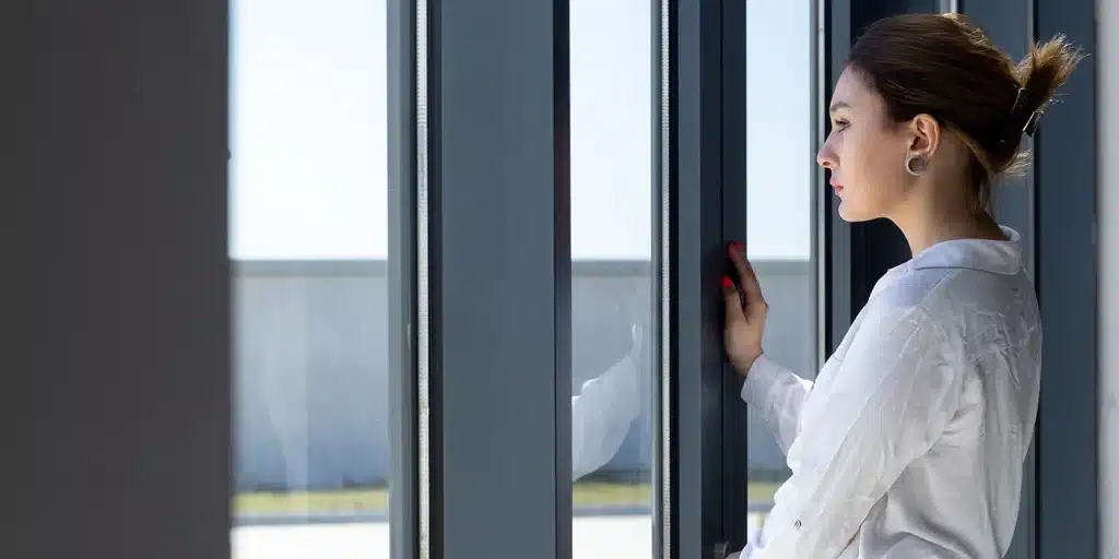 a woman looking out a window