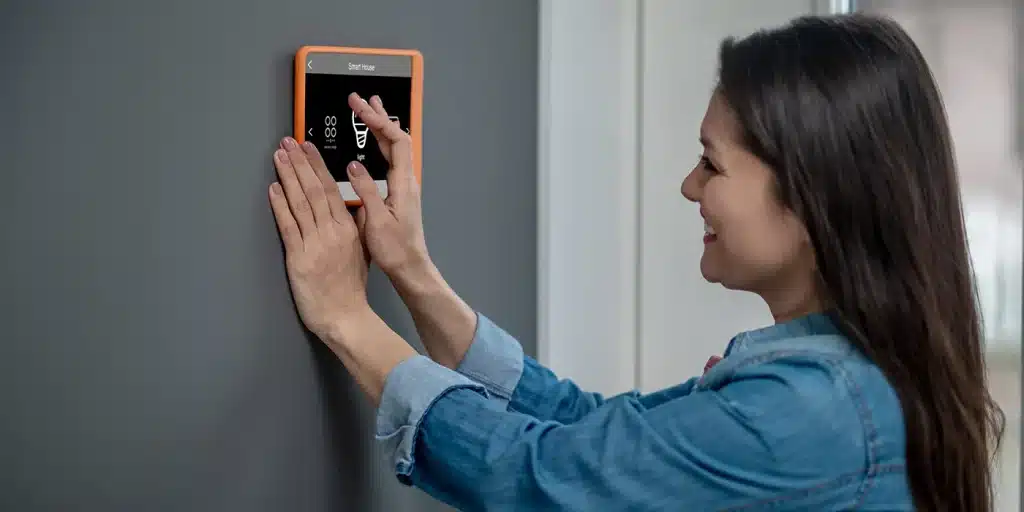 a woman touching a touch screen