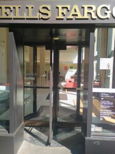 a glass door with a sign on it