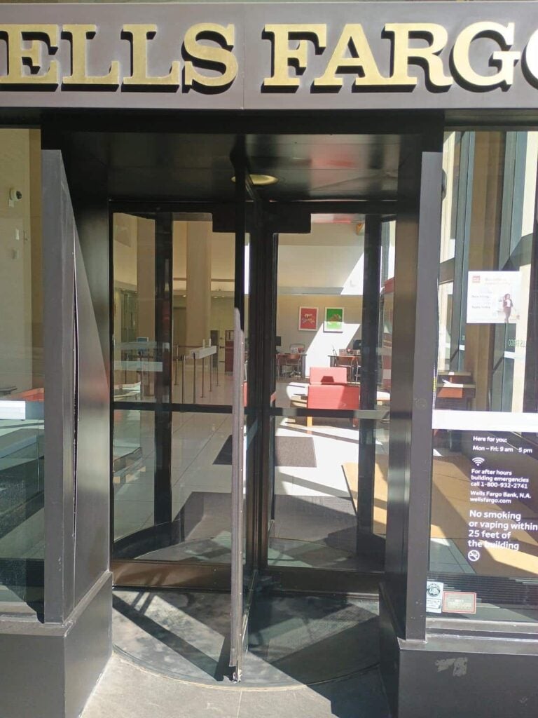 a glass door with a sign on it
