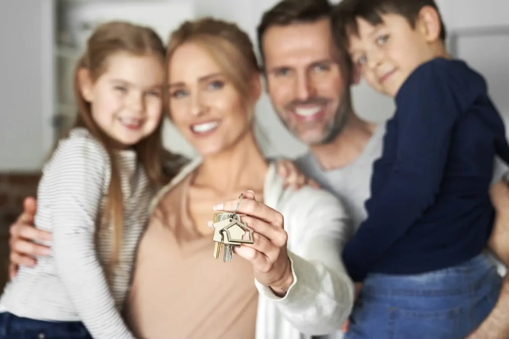 Family holding a new key after a lock change by Golden Key Locksmith NYC