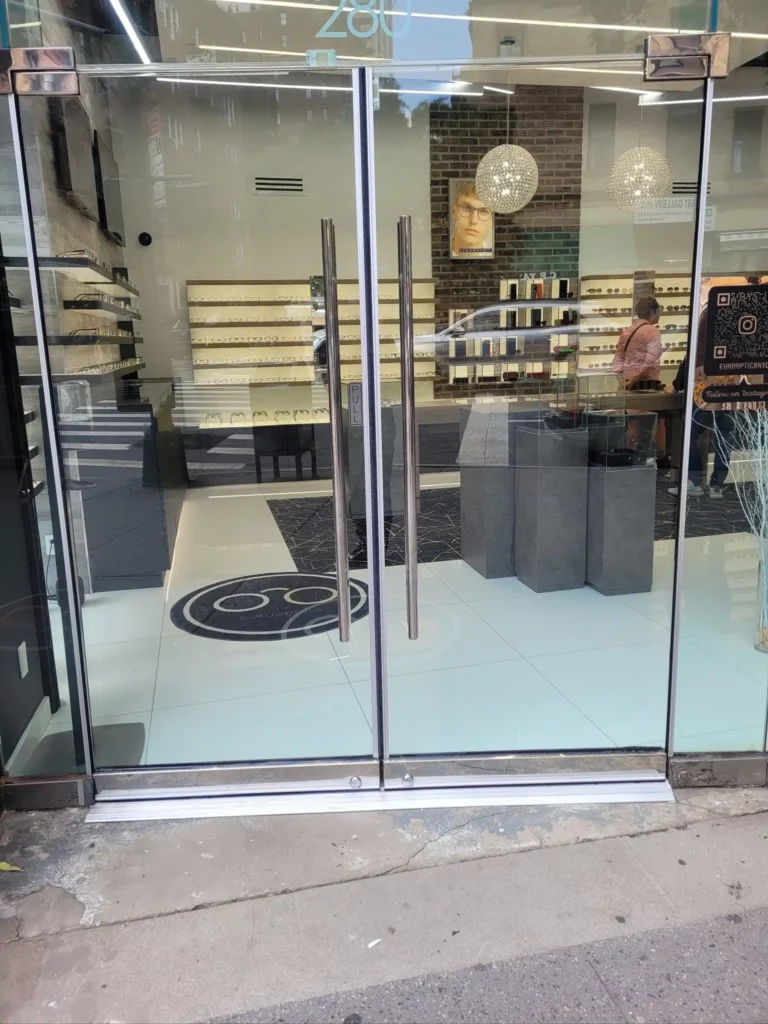 Modern glass storefront with display shelves
