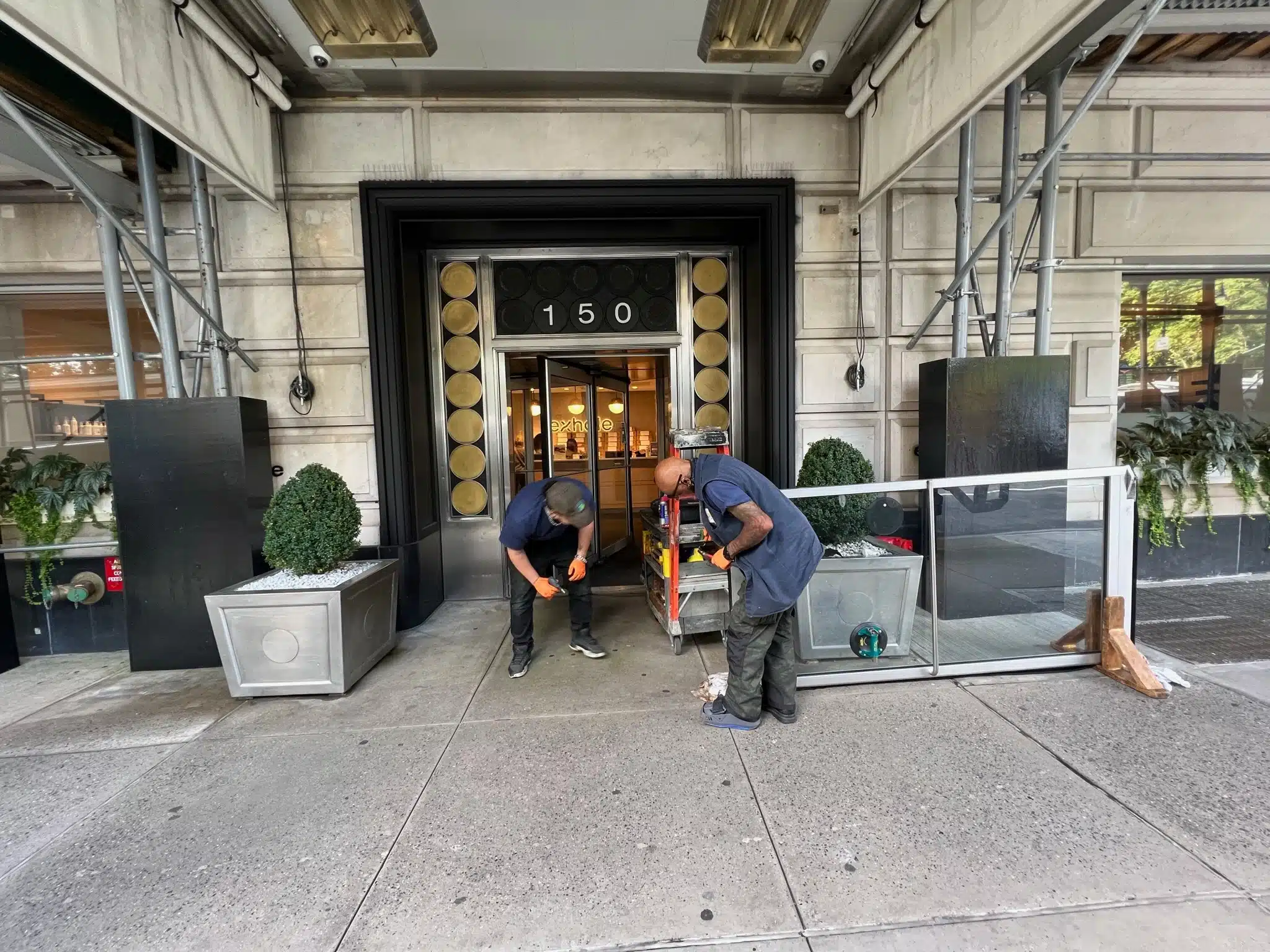 Glass storefront door installed by Golden Key Locksmith NYC