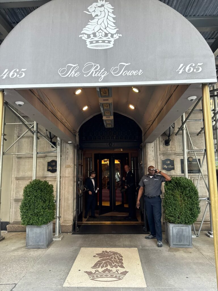 The Ritz Tower entrance on Park Avenue with ornate canopy and doormen - a landmark NYC building