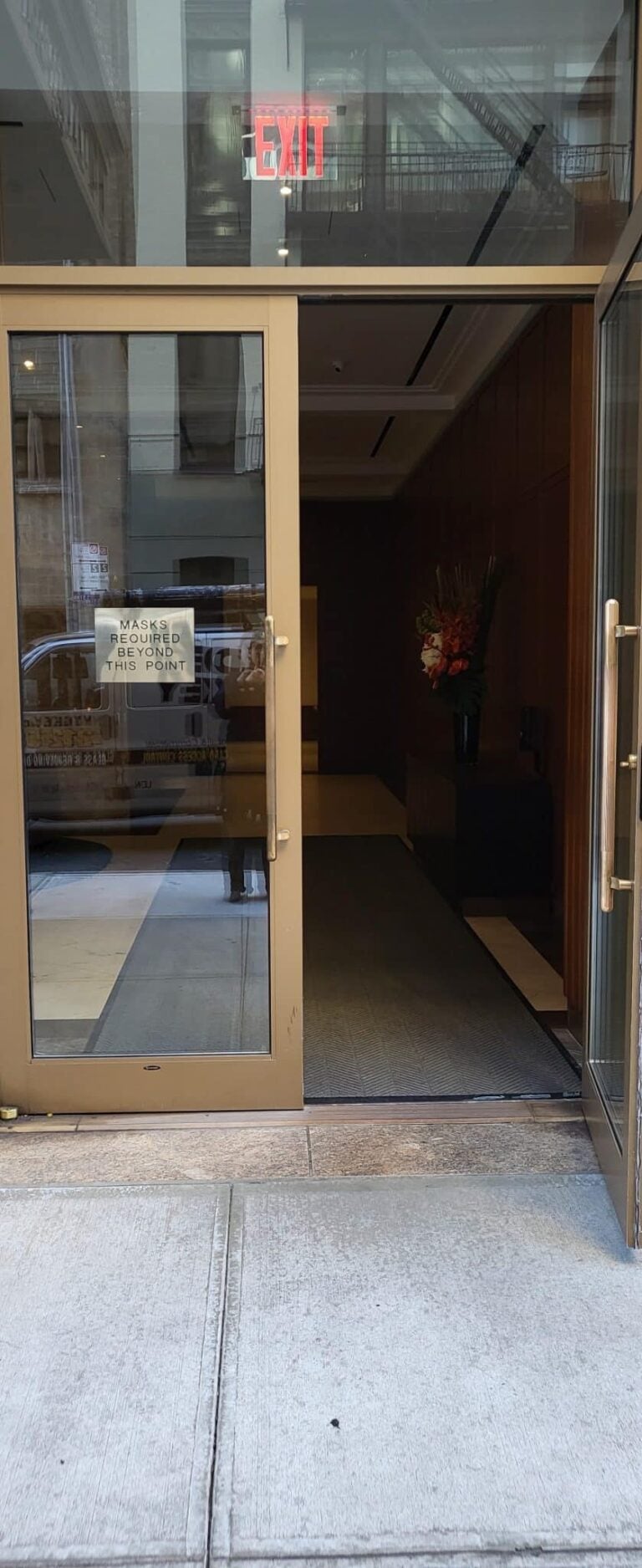 Golden Key Locksmith NYC bonded and insured locksmith installing a deadbolt on an apartment door at a Manhattan townhouse in Chinatown, Manhattan