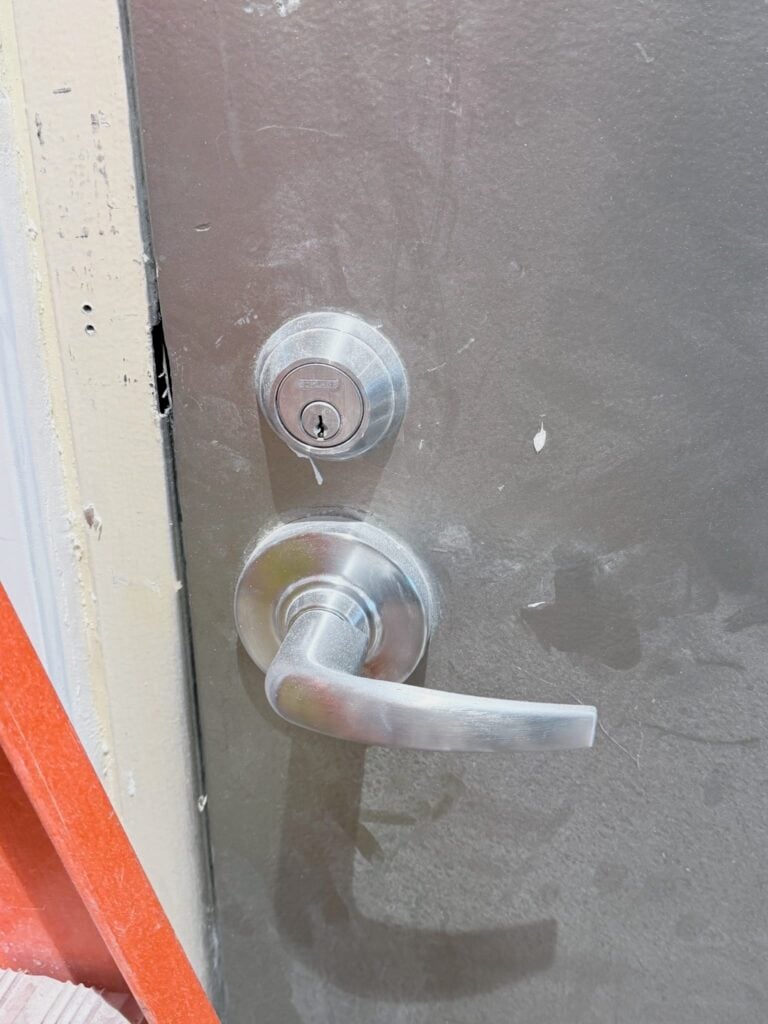 Commercial deadbolt and lever handle lock installed by Golden Key Locksmith NYC for safe opening service in NYC
