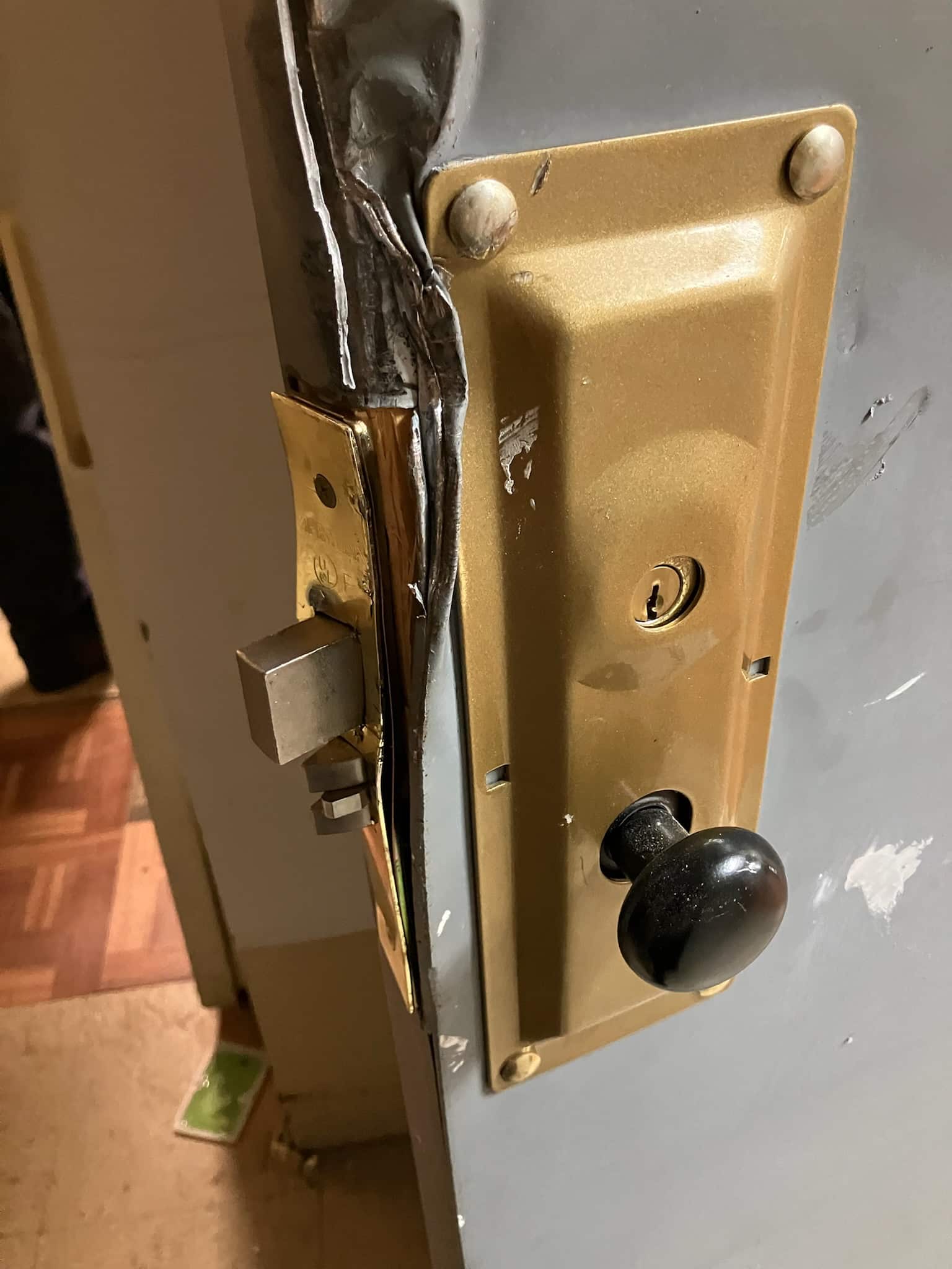 a door lock with a black knob