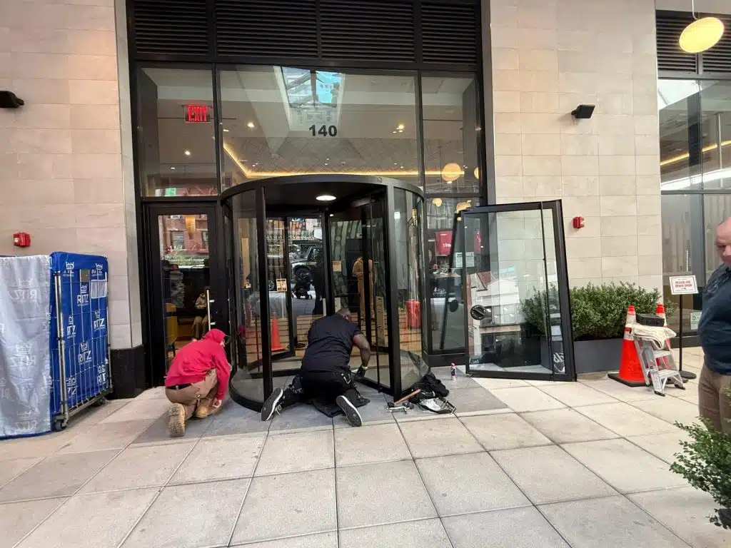 a group of people working outside a building