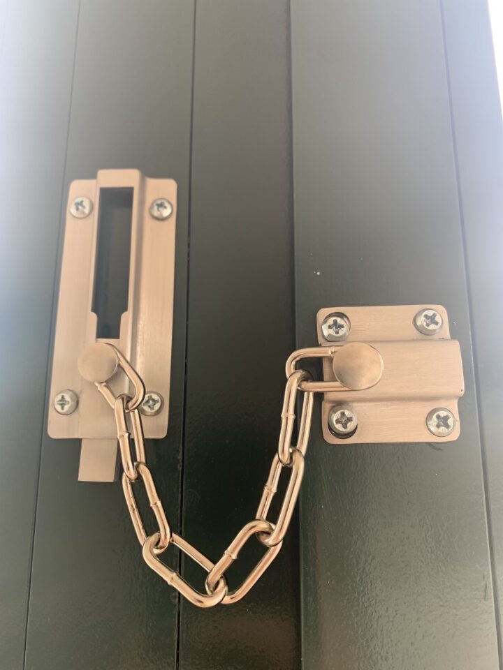 a lock with a chain on a black surface