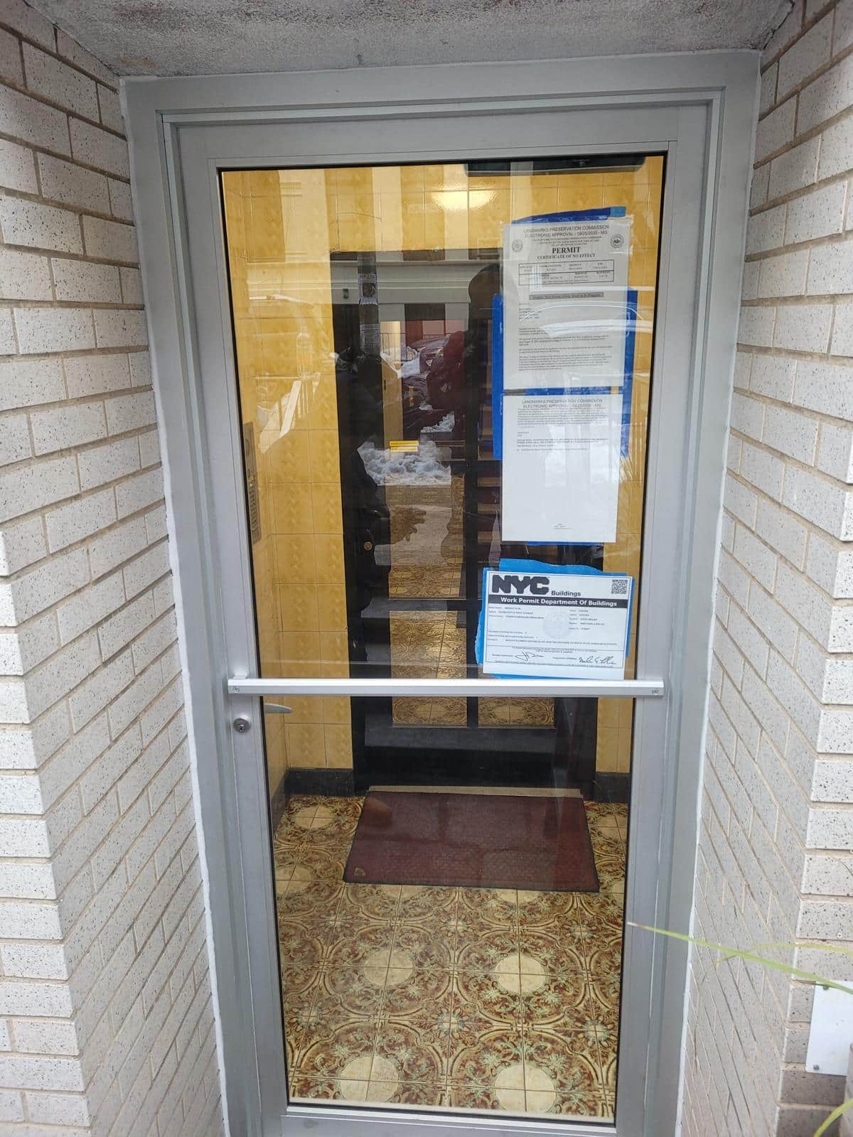a glass door with a sign on it