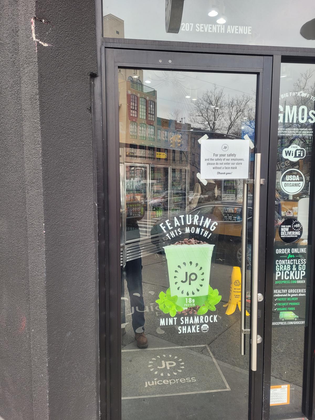 a glass door with a sign on it