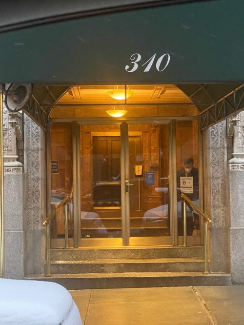 Elegant NYC building entrance at 310 with brass hardware - Golden Key Locksmith NYC business lockout service
