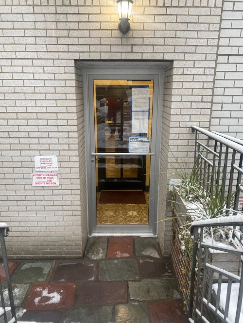 NYC building entrance door with push bar and key fob reader installed by Golden Key Locksmith NYC