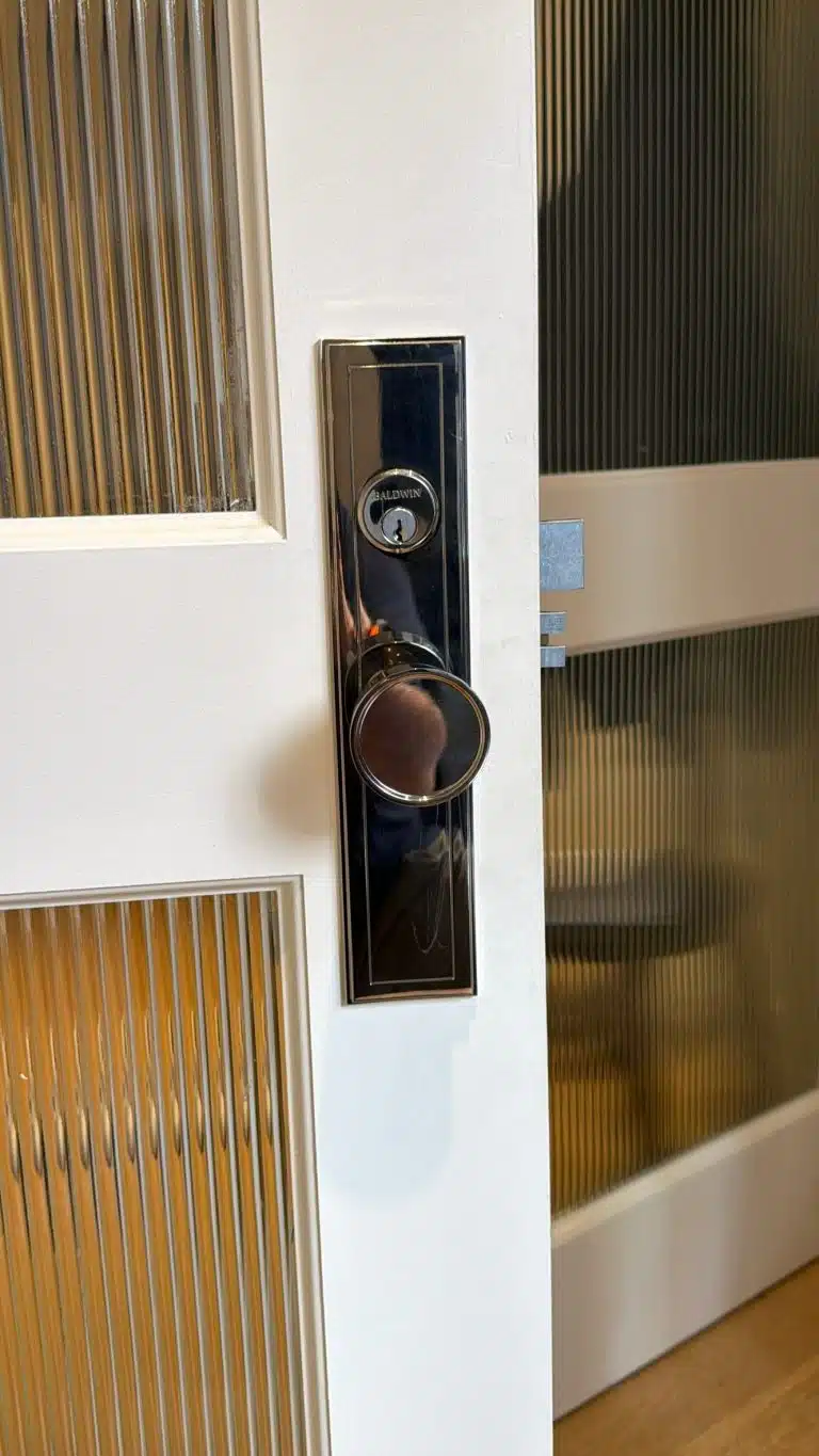 Premium Baldwin door lock and handle set on a white residential door in NYC