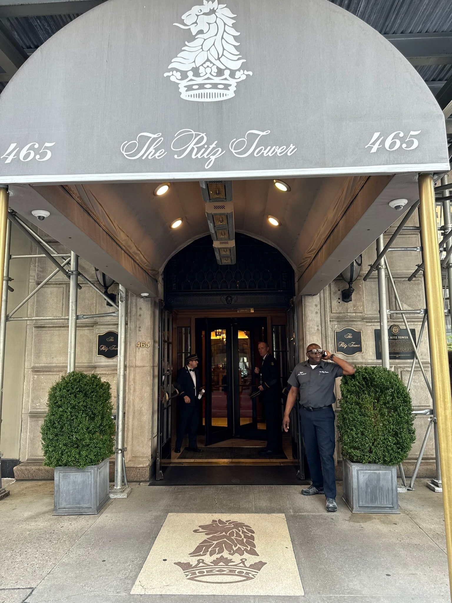 The Ritz Tower entrance on Park Avenue with ornate canopy and doormen - a landmark NYC building