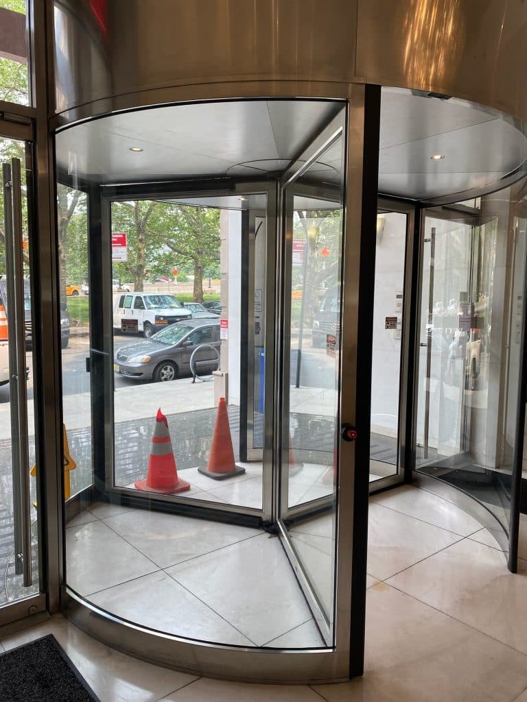 Reliable Golden Key Locksmith NYC locksmith installing a high-security lock near a high-rise apartment building in Midtown East, Manhattan NYC