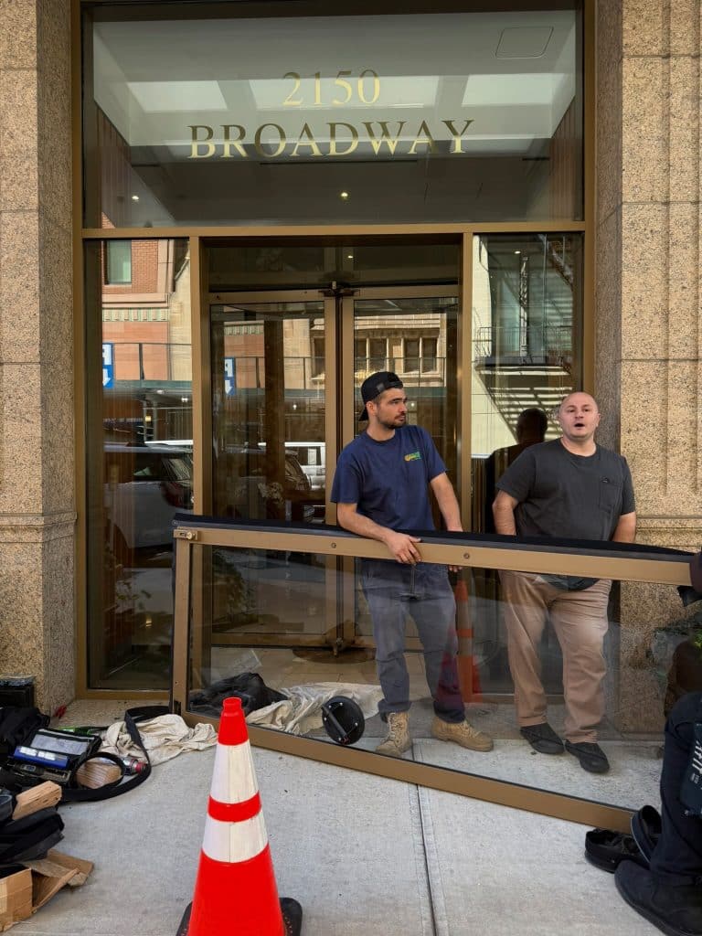 Reliable Golden Key Locksmith NYC locksmith servicing a commercial door frame near a residential co-op in Upper East Side, Manhattan NYC