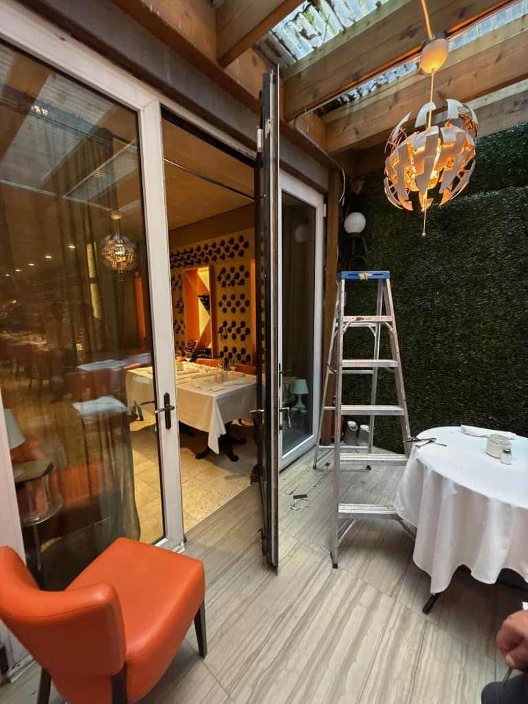 Residential glass balcony door with weatherstripping seal in a New York City apartment